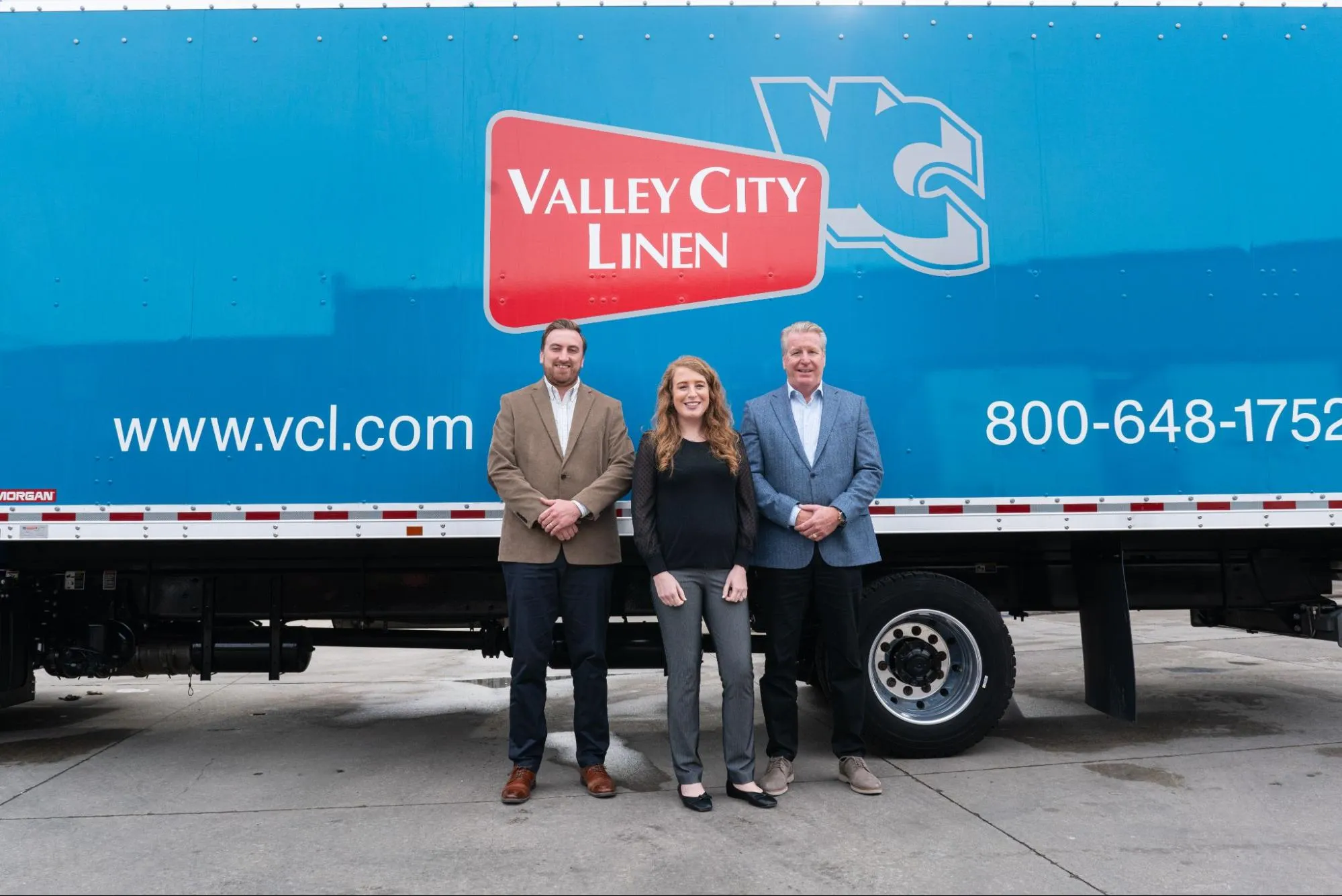 City Valley Linen team standing in front of company delivery truck