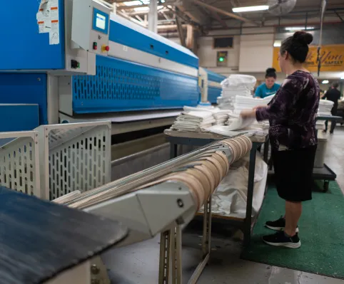 woman folding About Us - Woman Folding